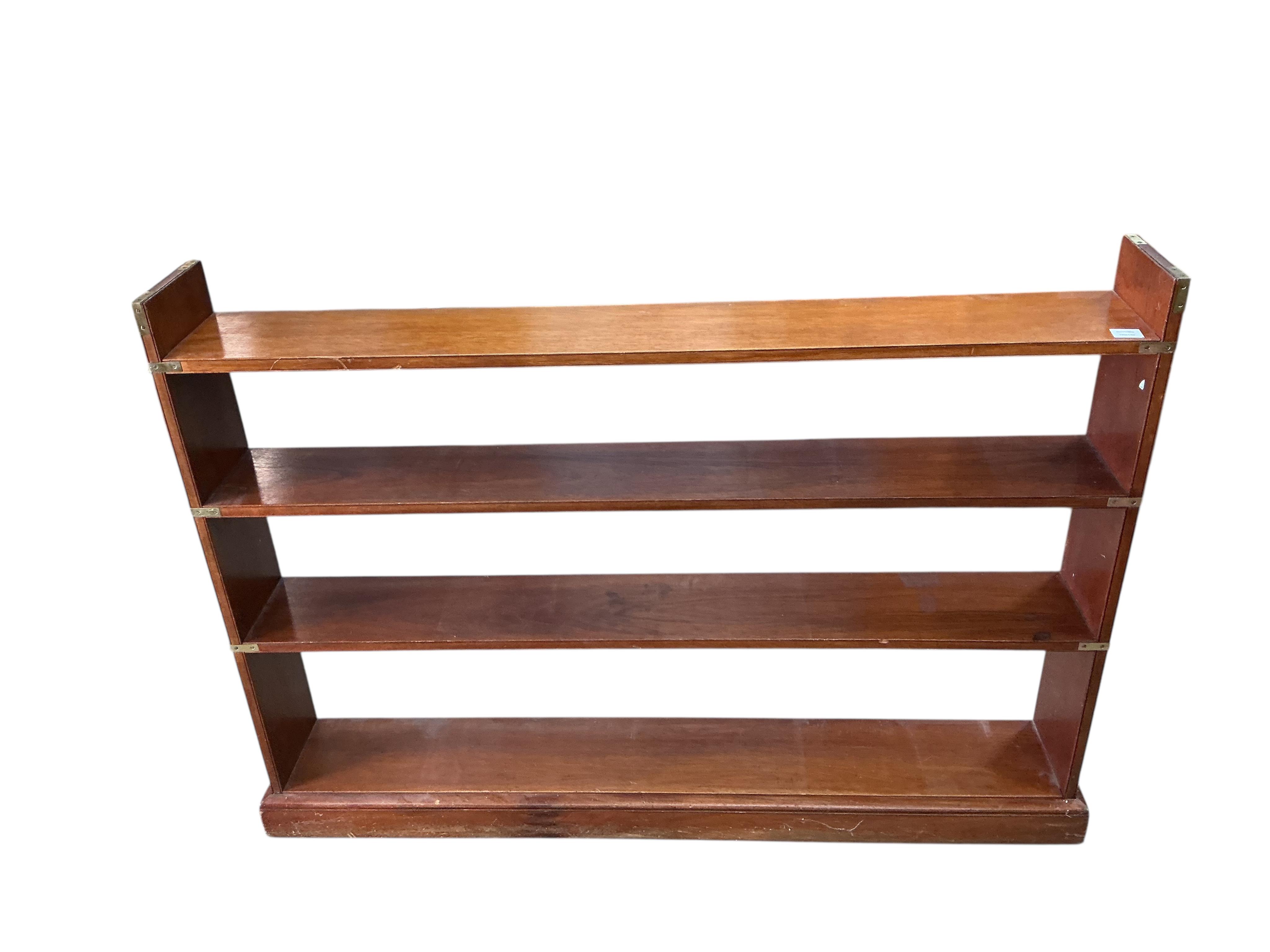 A military style brass mounted mahogany open bookcase, width 150cm, depth 23cm, height 108cm